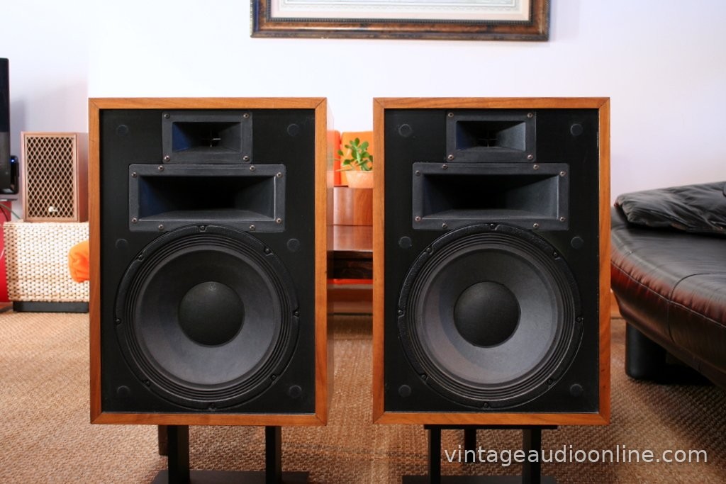 Klipsch Heresy II speakers with grilles removed, showing a 12-inch woofer and two horns on each